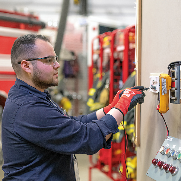 Service technician installing connected building solutions